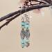 Handmade earrings with stacked sea sediment jasper beads and an ornate antiqued silver center bead.